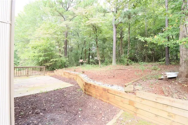 a backyard of a house with lots of green space