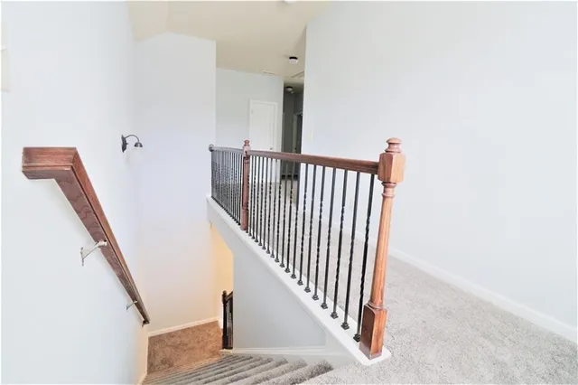 a view of a hallway with staircase