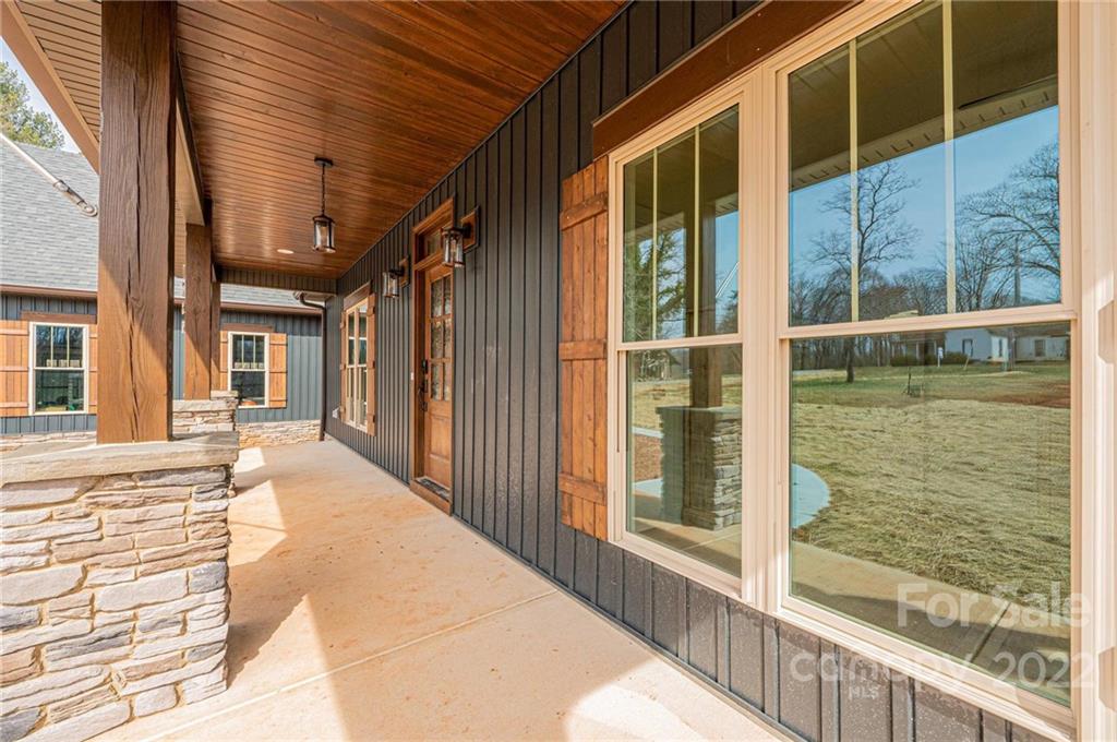 1289 Hopewell Church Road Hiddenite, NC 28636 - Photo 12 of 48 a view of a balcony with wooden floor and floor