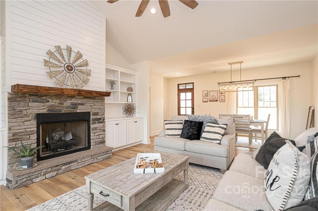 1289 Hopewell Church Road Hiddenite, NC 28636 - Photo 20 of 48 a living room with furniture a window and a fireplace