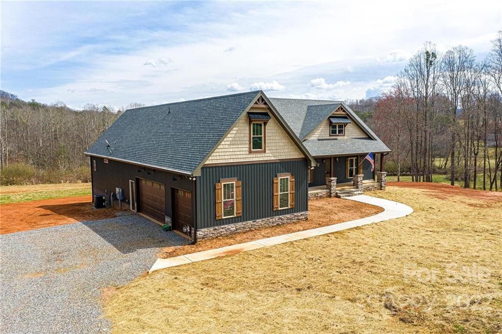 1289 Hopewell Church Road Hiddenite, NC 28636 - Photo 2 of 48 a house with a outdoor space