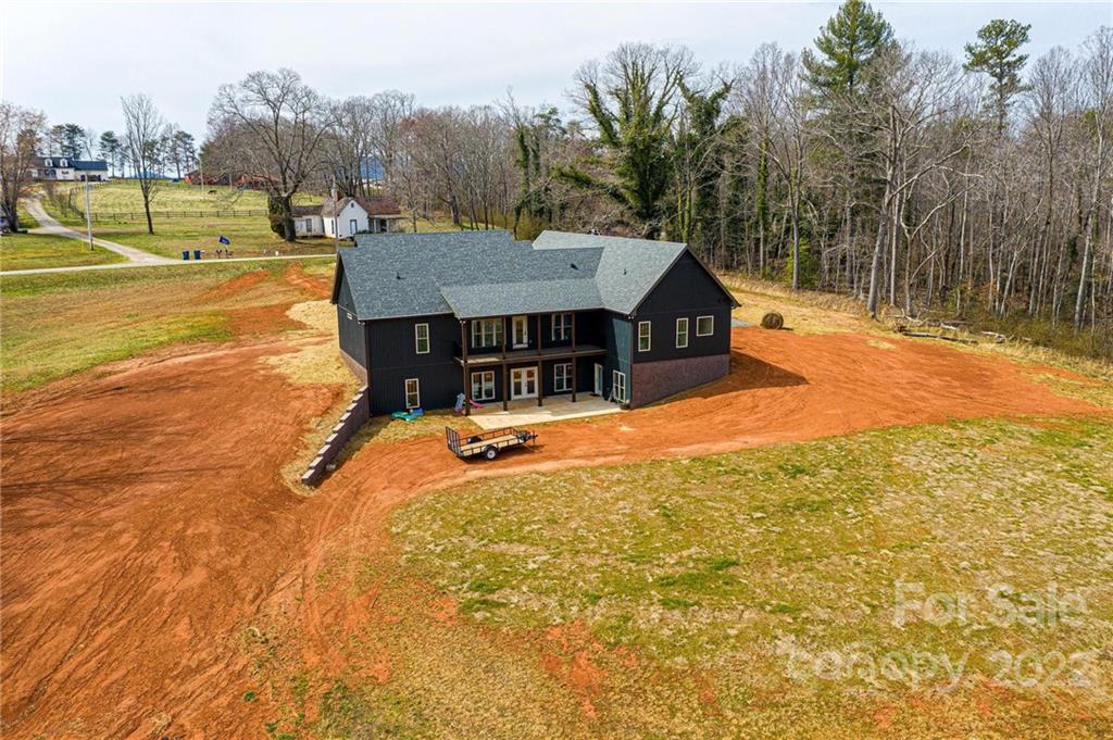 1289 Hopewell Church Road Hiddenite, NC 28636 - Photo 3 of 48 a view of a house with pool and a yard