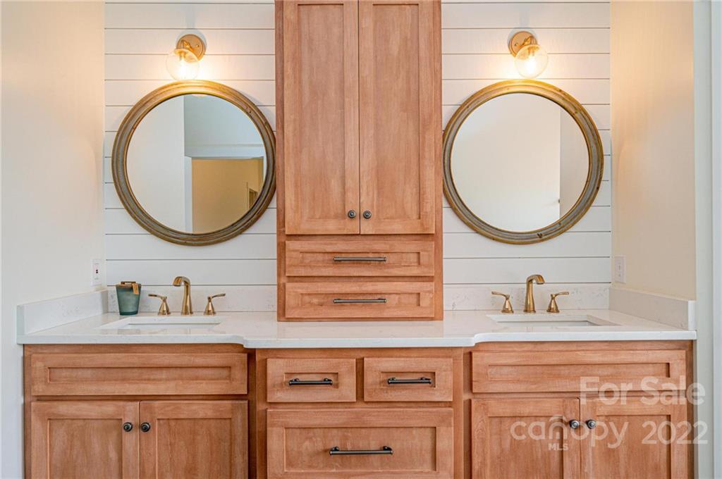 1289 Hopewell Church Road Hiddenite, NC 28636 - Photo 31 of 48 a bathroom with a sink and a mirror