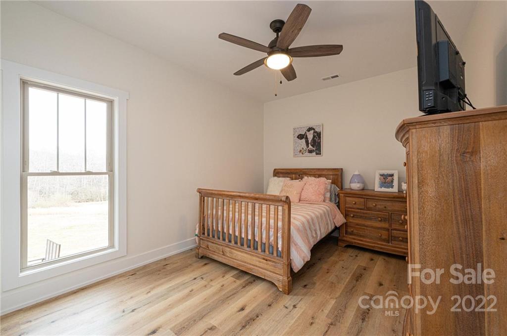 1289 Hopewell Church Road Hiddenite, NC 28636 - Photo 33 of 48 a bed room with a bed and a window