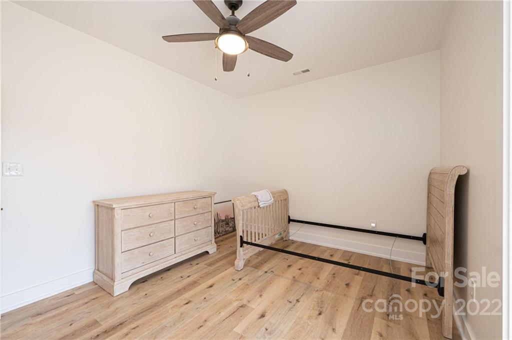 1289 Hopewell Church Road Hiddenite, NC 28636 - Photo 36 of 48 wooden floor in an empty room