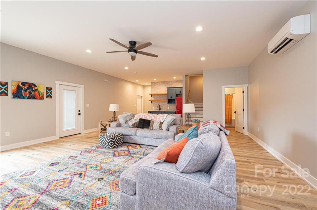 1289 Hopewell Church Road Hiddenite, NC 28636 - Photo 41 of 48 a living room with furniture and a rug