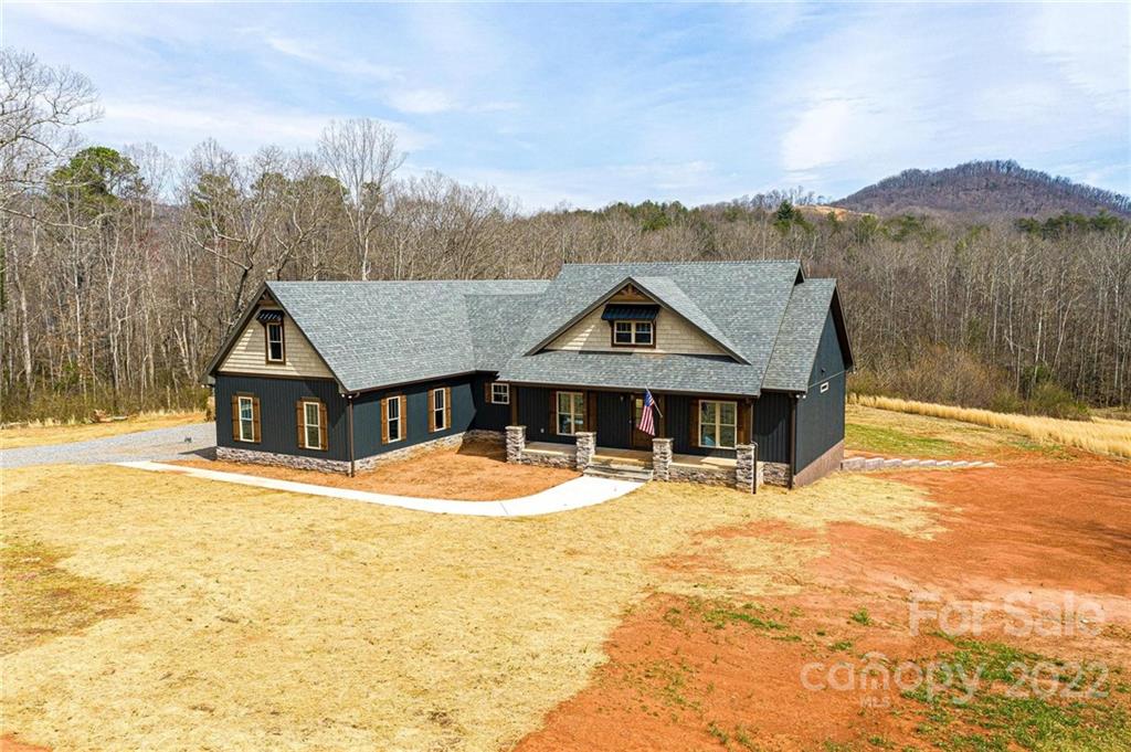 1289 Hopewell Church Road Hiddenite, NC 28636 - Photo 5 of 48 a front view of a house with a yard