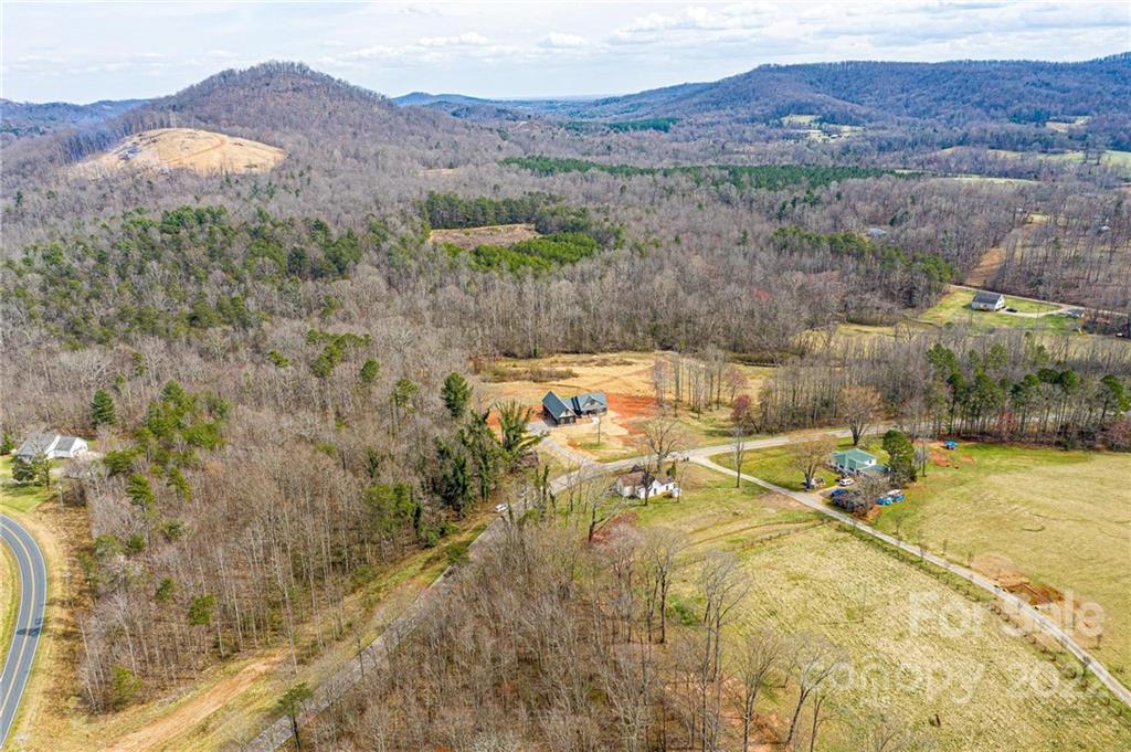 1289 Hopewell Church Road Hiddenite, NC 28636 - Photo 8 of 48 a view of residential houses with outdoor space