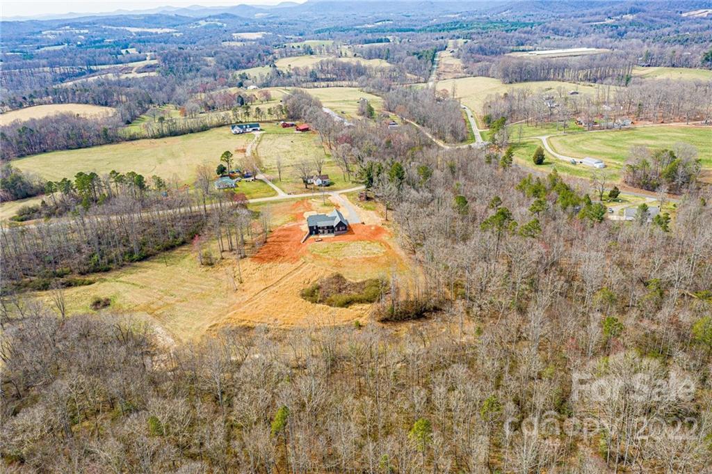 1289 Hopewell Church Road Hiddenite, NC 28636 - Photo 9 of 48 an aerial view of residential houses with outdoor space