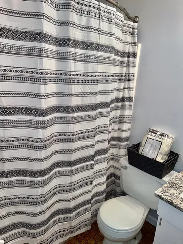 a bathroom with a toilet and a sink