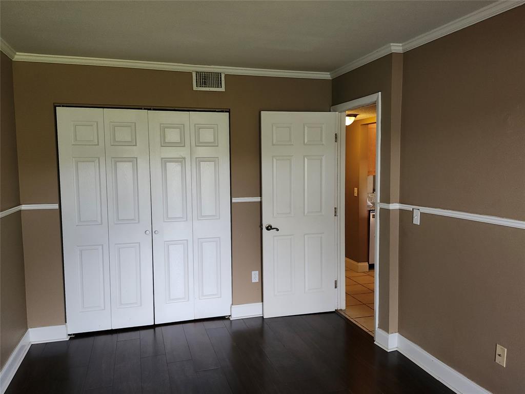 4192 Southwest 87th Terrace Davie, FL 33328 - Photo 16 of 35 an empty room with wooden floor door and closet