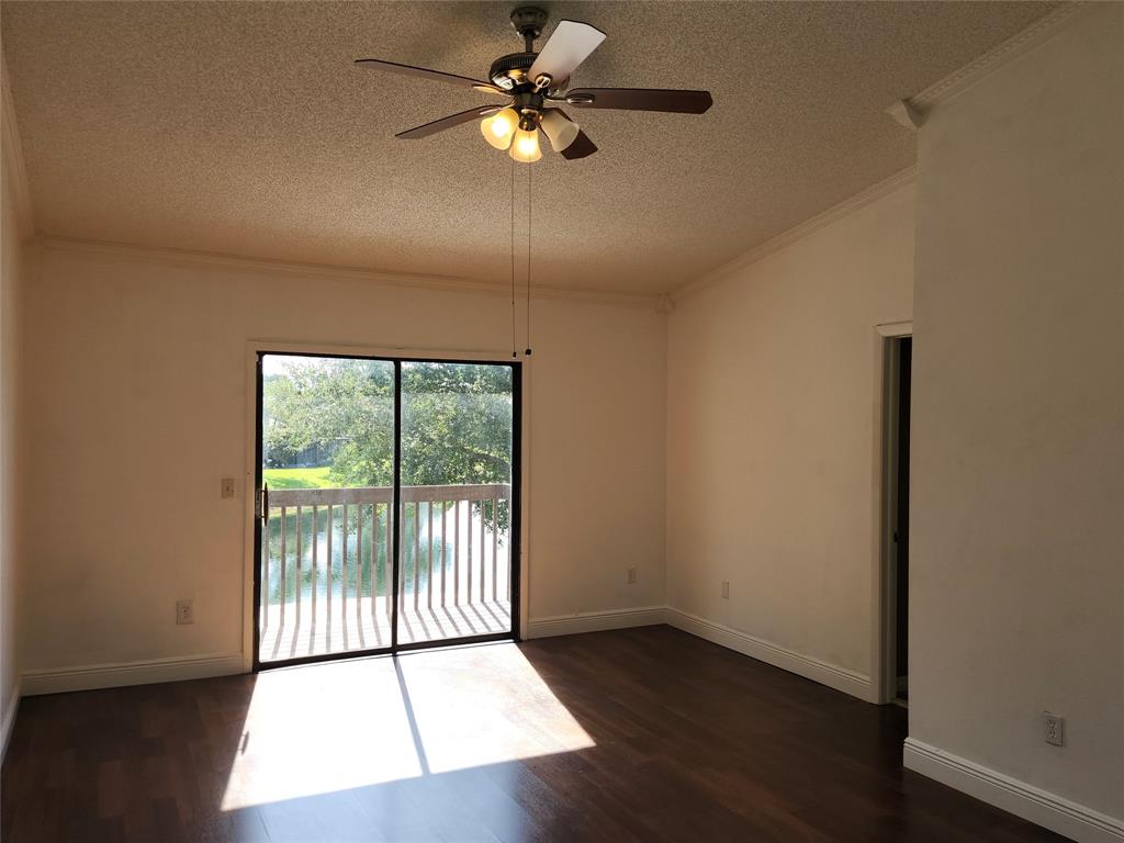 4192 Southwest 87th Terrace Davie, FL 33328 - Photo 19 of 35 wooden floor in an empty room with a window