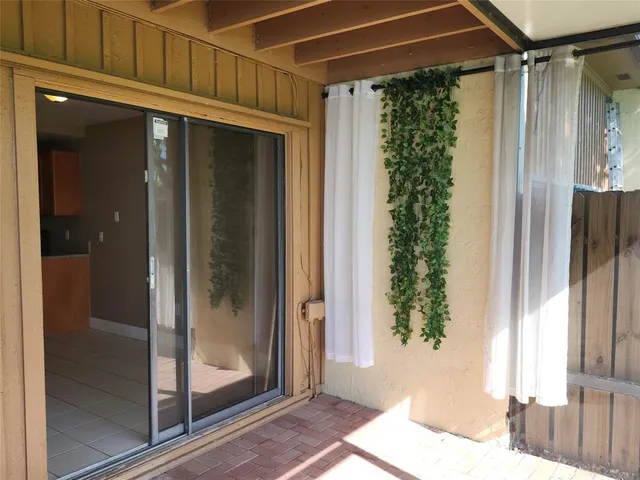 a view of swimming pool with outdoor seating and yard in back