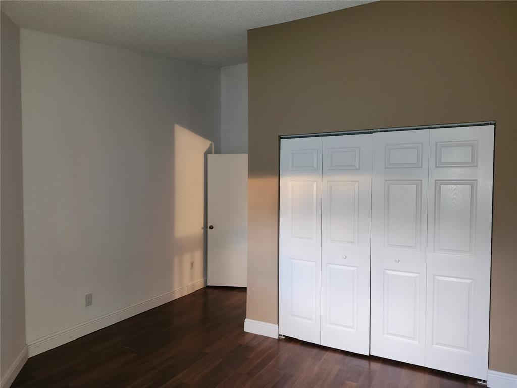 4192 Southwest 87th Terrace Davie, FL 33328 - Photo 25 of 35 an empty room with wooden floor