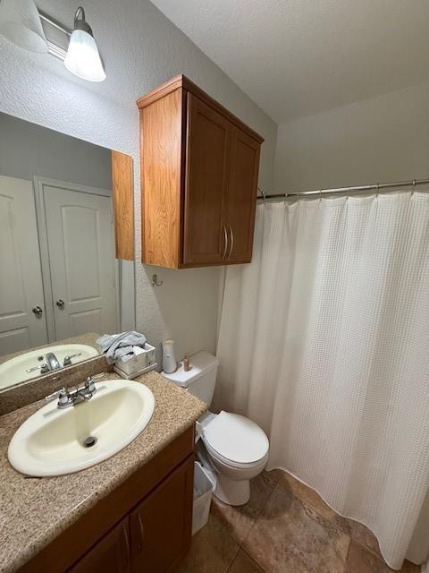 2513 South 2nd Street, Unit 3 Waco, TX 76706 - Photo 14 of 35 a bathroom with a sink toilet and mirror