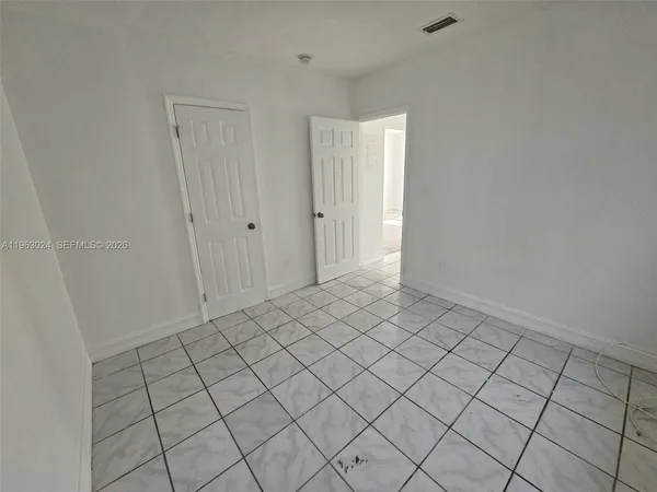 a view of an empty room and window