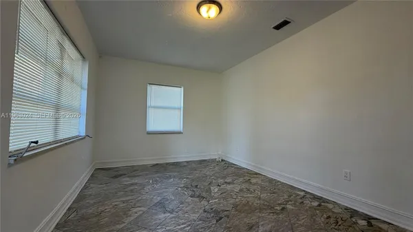 a kitchen with a stove and a cabinet