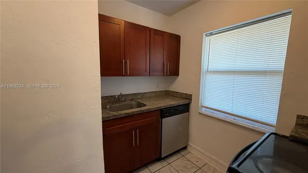 a kitchen with a stove and a microwave