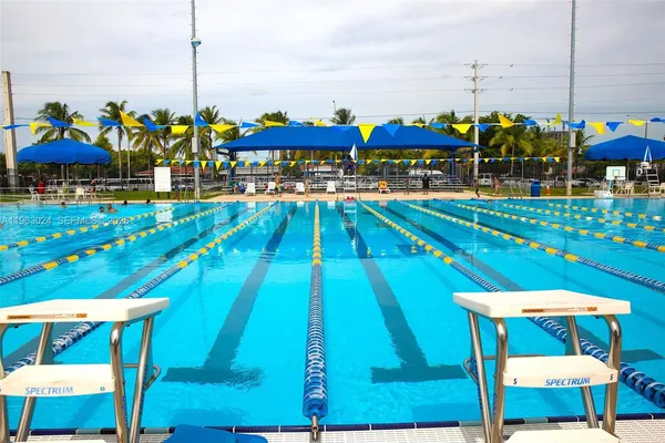 a view of an chairs and table on the patio