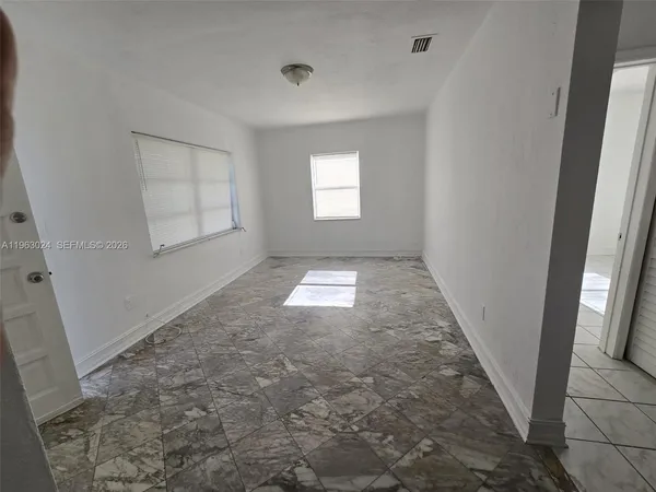 a kitchen with granite countertop stainless steel appliances and wooden cabinets