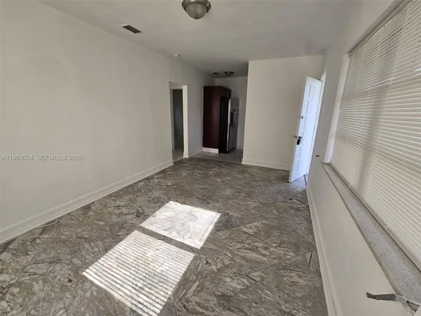a view of a car in front of a house
