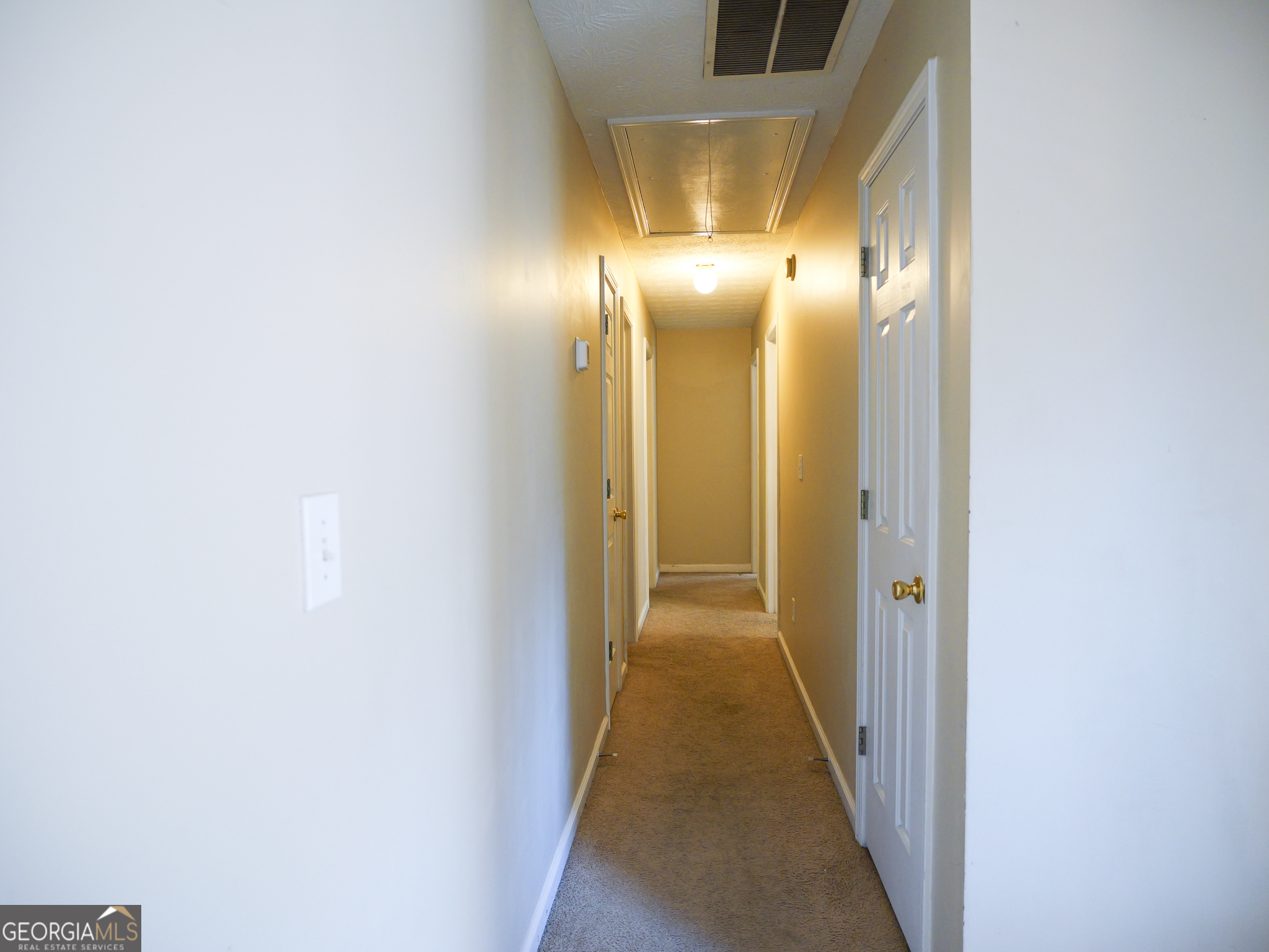 11036 Pebble Ridge Drive Hampton, GA 30228 - Photo 13 of 35 a view of a hallway with wooden floor