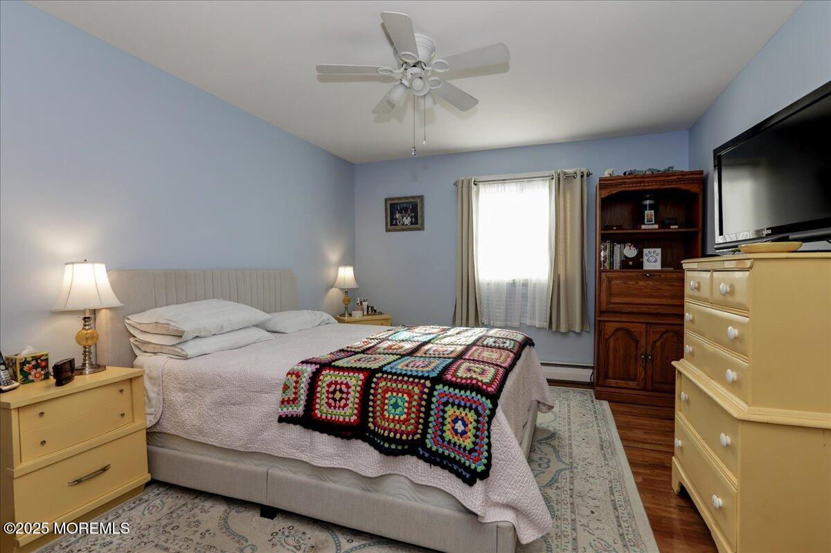 9 D Cardinal Street Manchester Township, NJ 08759 - Photo 25 of 30 a bedroom with a bed and a tv on the dresser