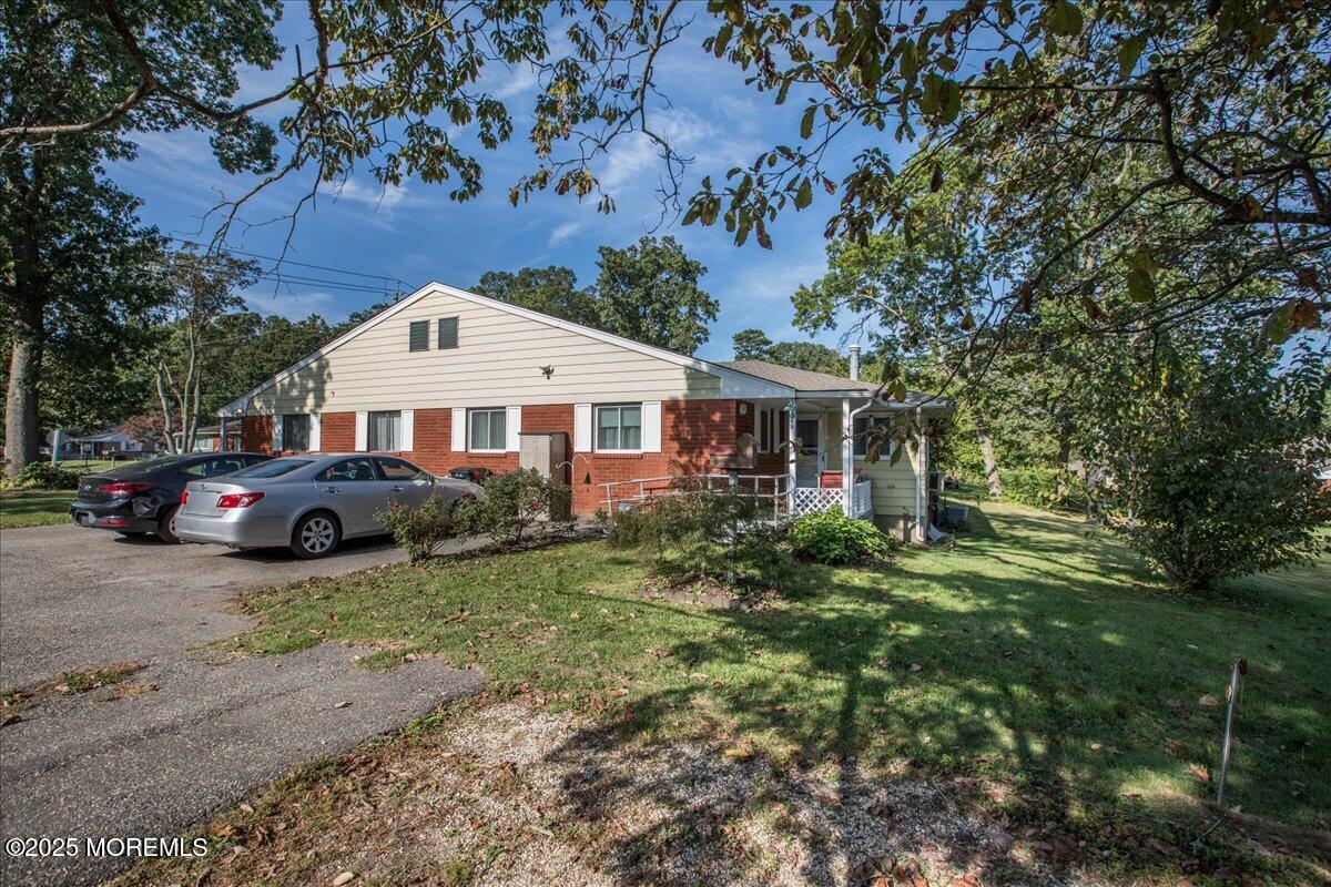9 D Cardinal Street Manchester Township, NJ 08759 - Photo 27 of 30 a front view of a house with a garden