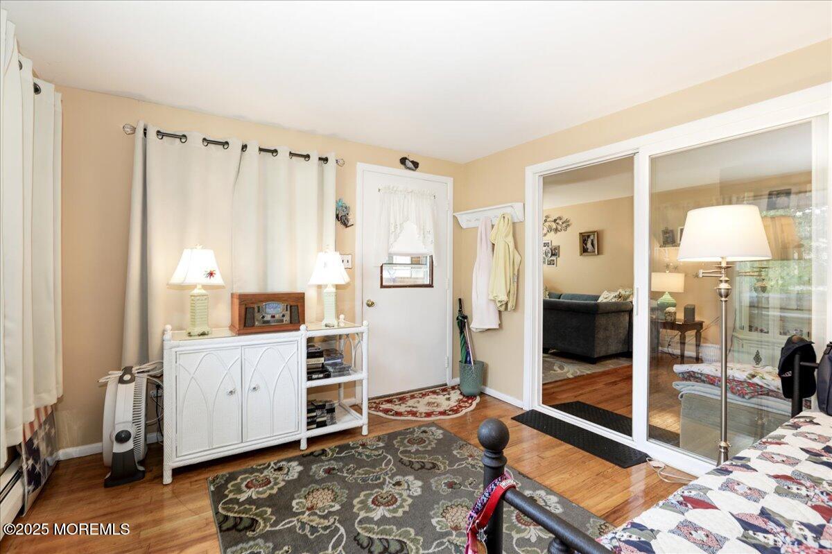 9 D Cardinal Street Manchester Township, NJ 08759 - Photo 3 of 30 a room with a bed and a table