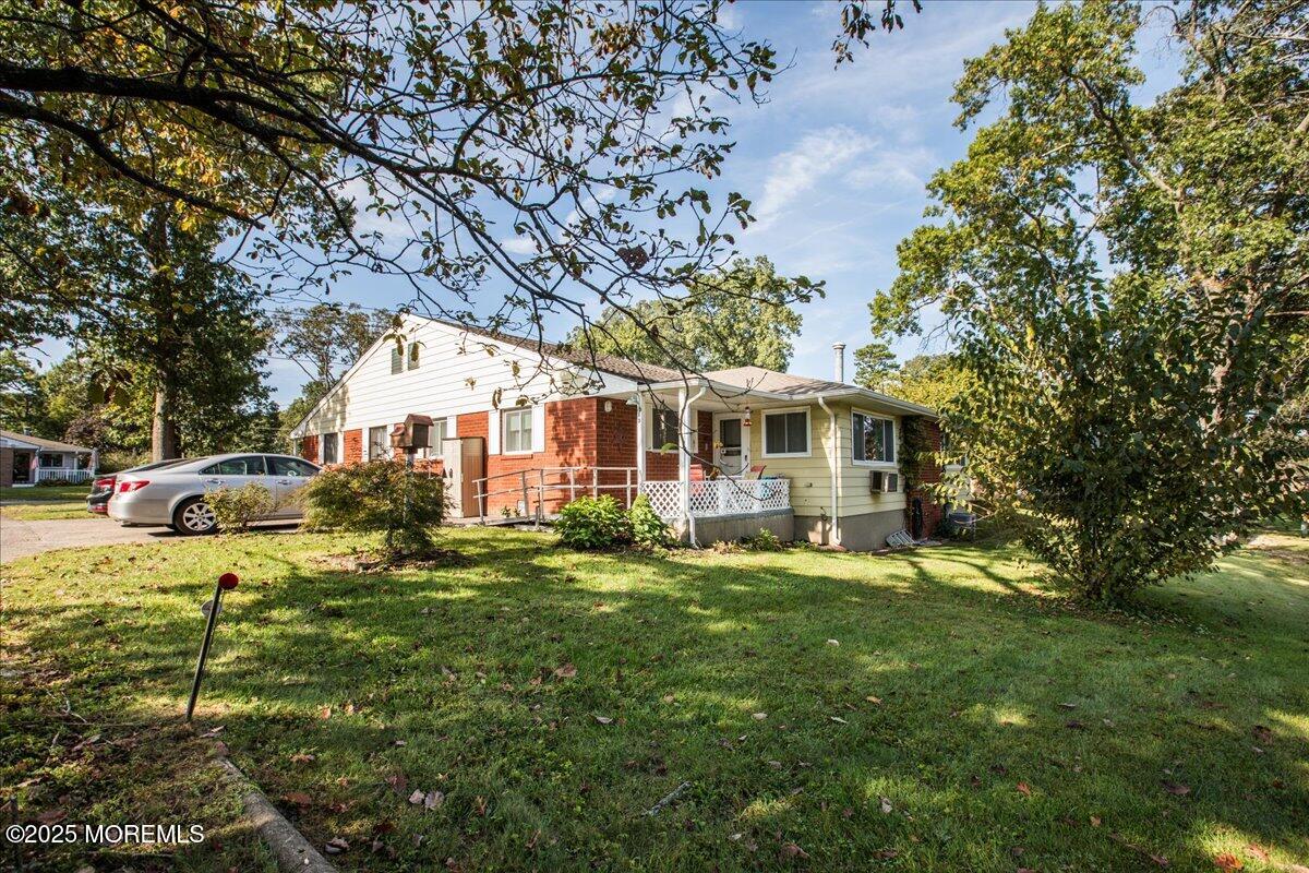 9 D Cardinal Street Manchester Township, NJ 08759 - Photo 6 of 30 a front view of a house with garden