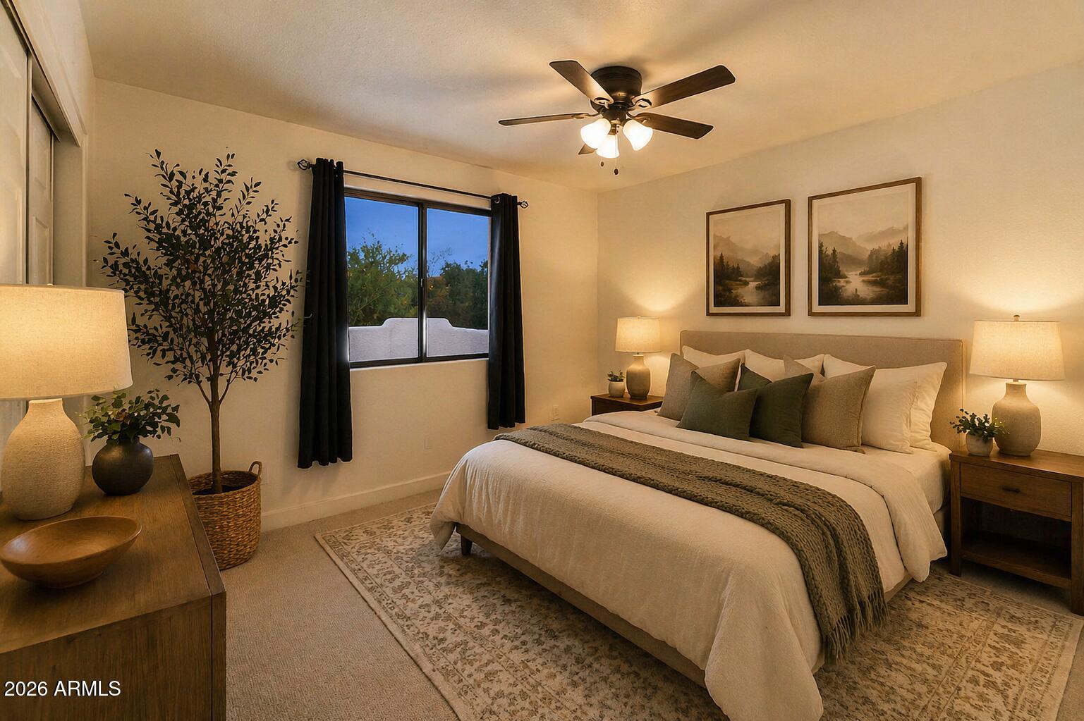 310 North Mountain View Road Apache Junction, AZ 85119 - Photo 12 of 14 a bedroom with a large bed and a chandelier