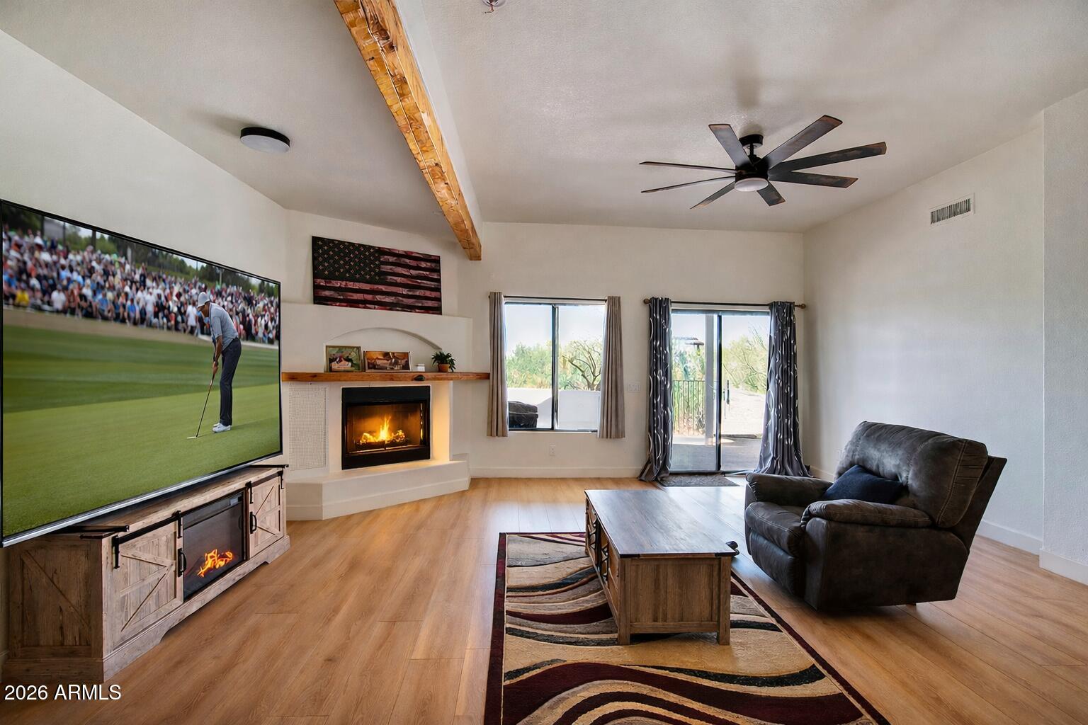 310 North Mountain View Road Apache Junction, AZ 85119 - Photo 5 of 14 a living room with furniture and a fireplace