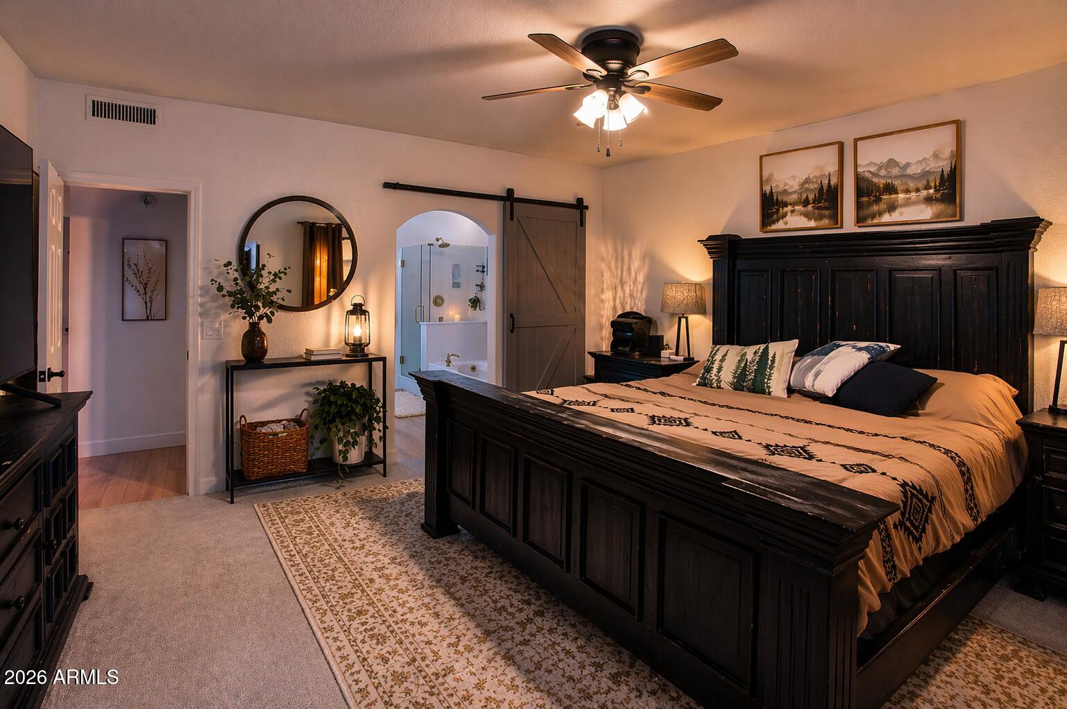 310 North Mountain View Road Apache Junction, AZ 85119 - Photo 8 of 14 a bedroom with a bed a dresser and potted plants
