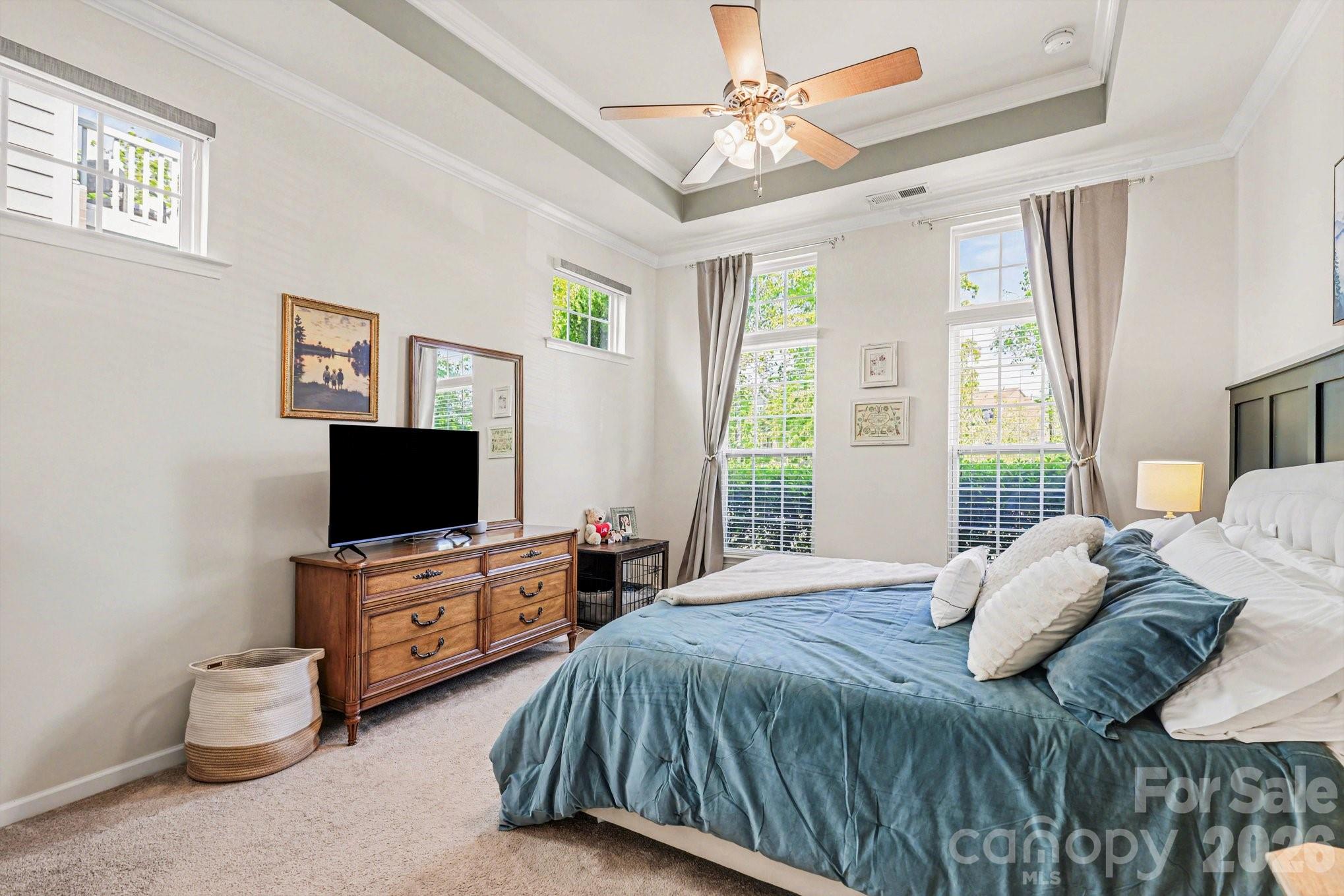 5153 Waterloo Drive Tega Cay, SC 29708 - Photo 12 of 29 a bedroom with a bed and a flat screen tv