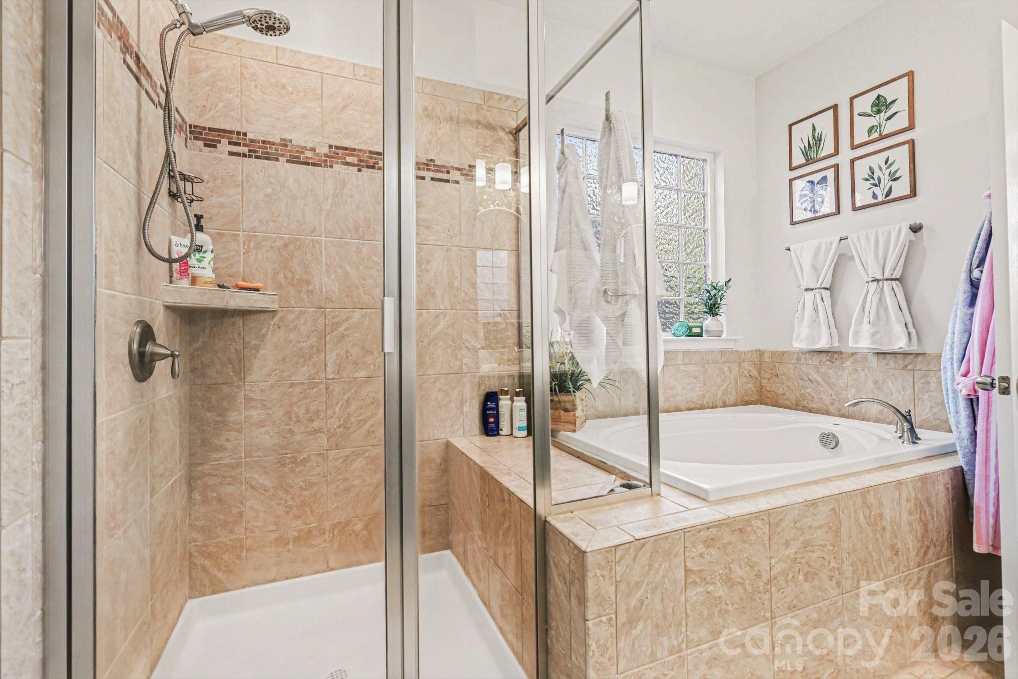 5153 Waterloo Drive Tega Cay, SC 29708 - Photo 15 of 29 a bathroom with a bath tub and a shower