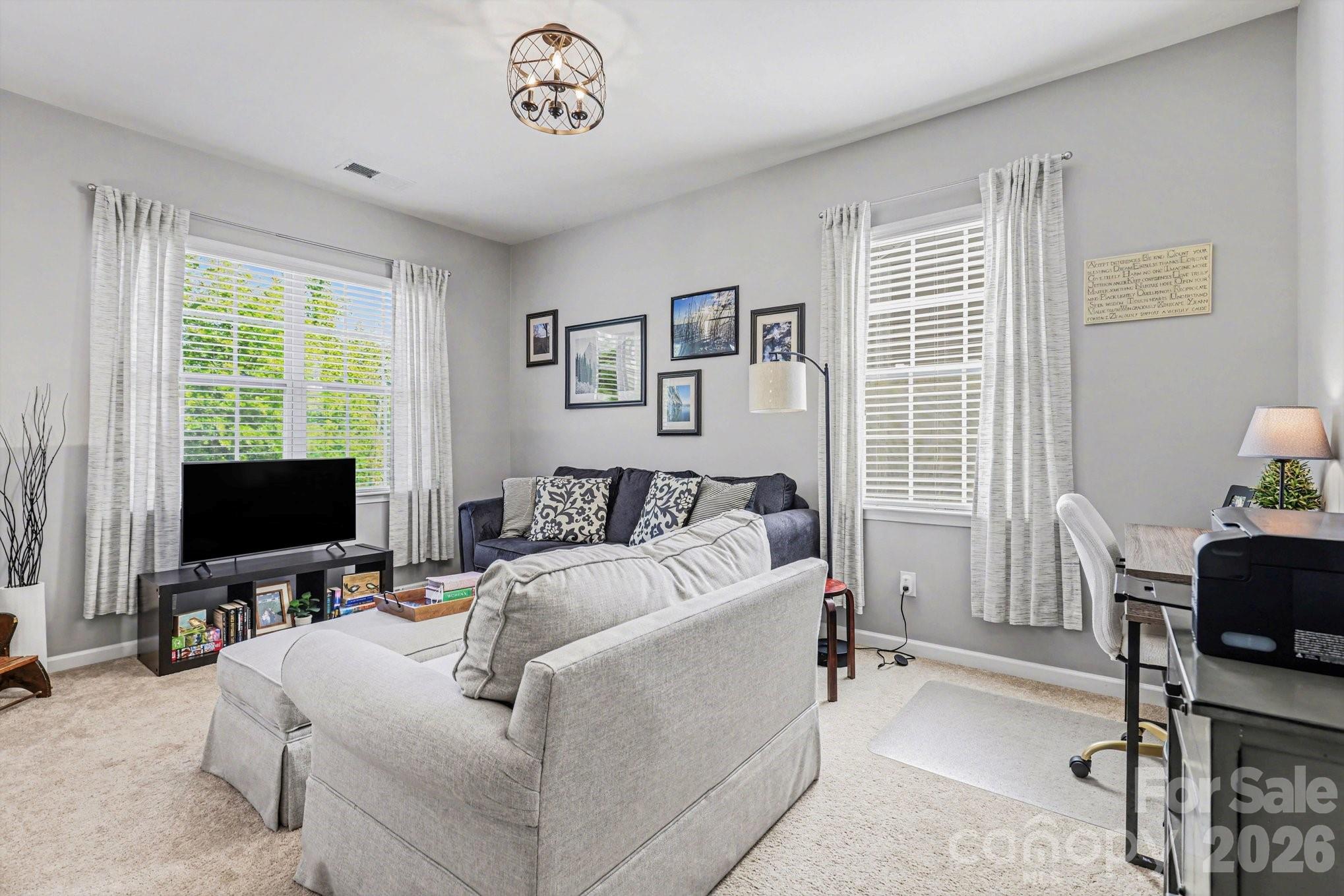 5153 Waterloo Drive Tega Cay, SC 29708 - Photo 17 of 29 a bed room with a bed television and a window