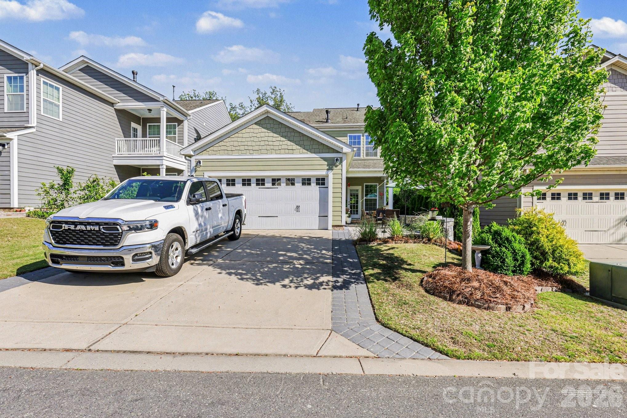 5153 Waterloo Drive Tega Cay, SC 29708 - Photo 29 of 29 a view of a white house in front of a yard