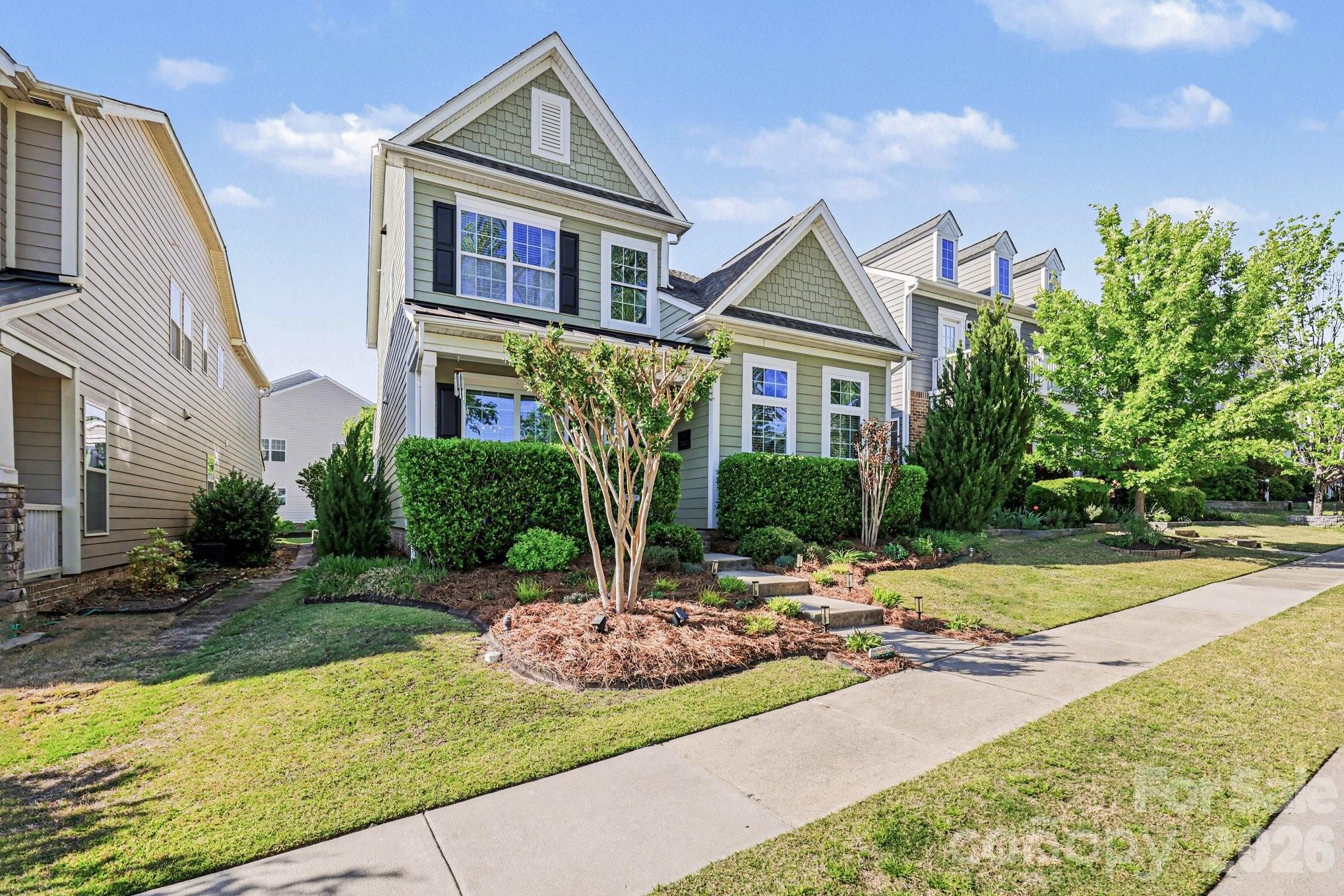 5153 Waterloo Drive Tega Cay, SC 29708 - Photo 3 of 29 a view of a house with backyard and sitting area