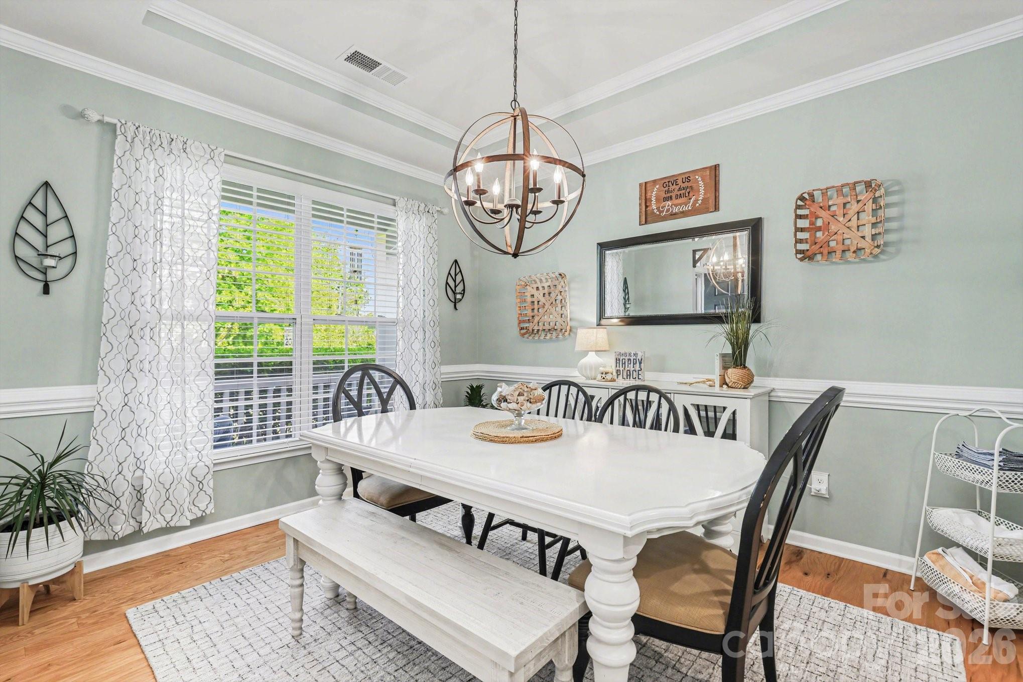 5153 Waterloo Drive Tega Cay, SC 29708 - Photo 5 of 29 a view of a dining room with furniture window and wooden floor