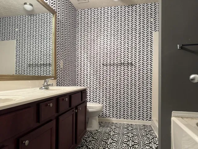 a bathroom with a sink and a toilet