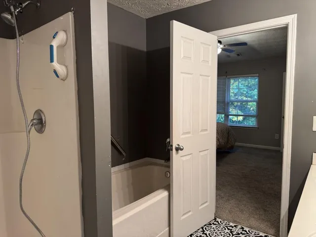 a bathroom with a bathtub and a shower
