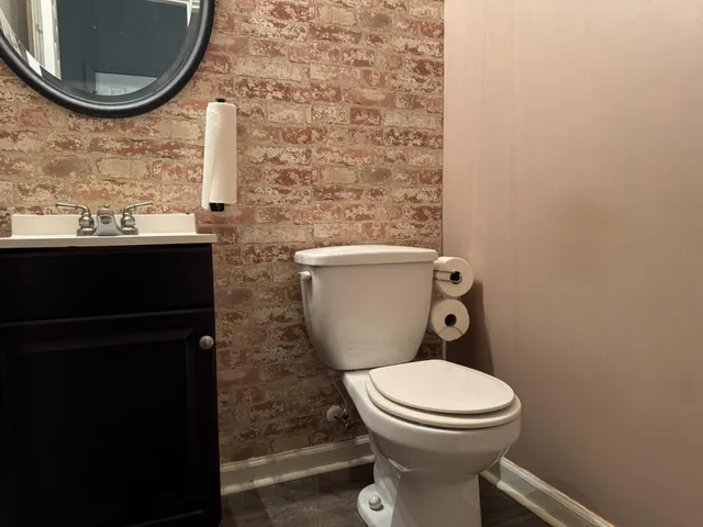 a bathroom with a toilet and a sink