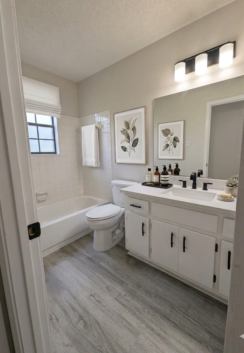 368 Tara Ridge Cove Collierville, TN 38017 - Photo 17 of 25 a bathroom with double vanity sink a mirror and a bathtub