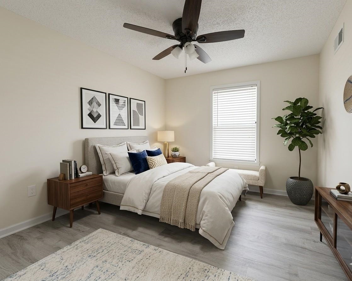 368 Tara Ridge Cove Collierville, TN 38017 - Photo 19 of 25 a bedroom with bed and a potted plant