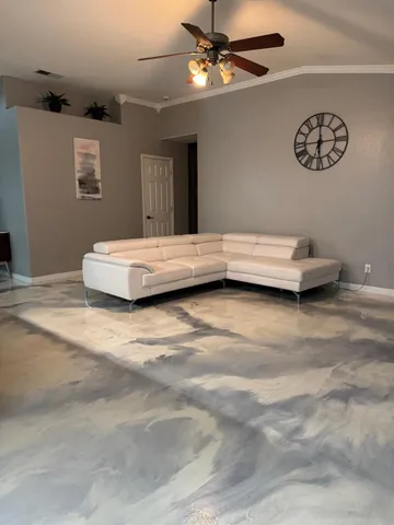 a living room with furniture and a window
