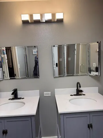 a bathroom with a sink and a mirror