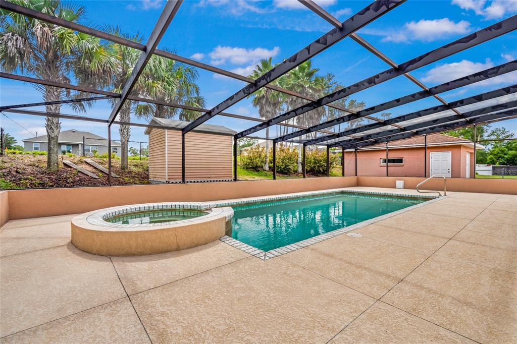 4190 Southwest 103rd Street Road Ocala, FL 34476 - Photo 12 of 55 a backyard of a house with garden and outdoor seating