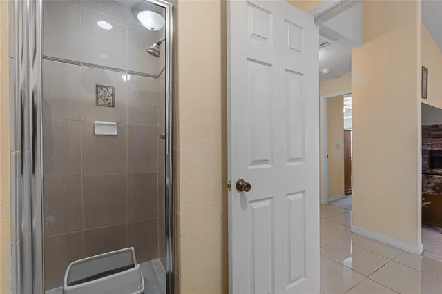 a bathroom with a sink a mirror and a shower