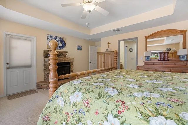 a spacious bathroom with a granite countertop sink toilet and shower