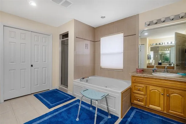 a living room with furniture a large window and a fireplace